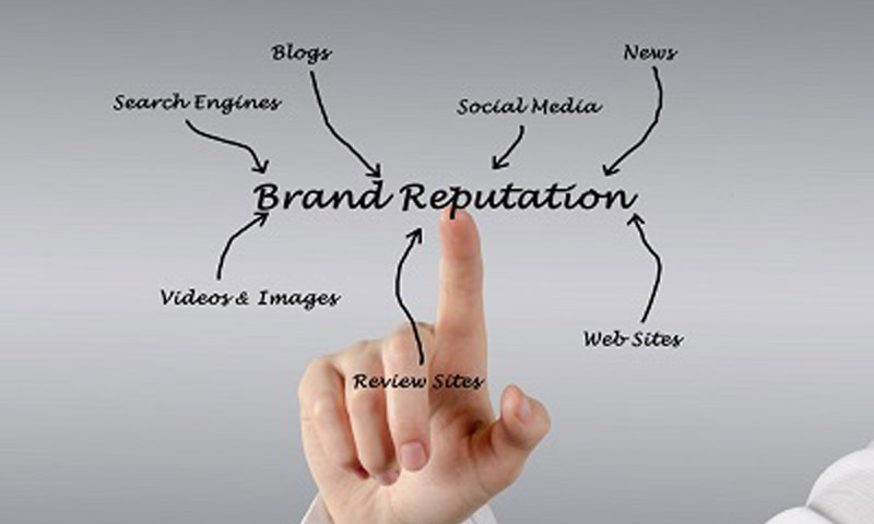 Hand pointing to brand reputation